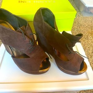 Brown synthetic suede lace up wedge, never worn is a sure show stopper
